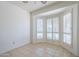Bright bedroom features tile flooring and bay windows with plantation shutters at 3415 N 36Th St # 3, Phoenix, AZ 85018