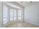 Bedroom featuring tile flooring and large windows with plantation shutters at 3415 N 36Th St # 3, Phoenix, AZ 85018