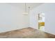 Open dining area with decorative chandelier and view to kitchen at 3415 N 36Th St # 3, Phoenix, AZ 85018