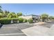 Charming home exterior with mature trees, parking area, and beautiful desert landscaping at 3415 N 36Th St # 3, Phoenix, AZ 85018