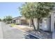 Street view of home showcasing covered carports and lush desert landscaping at 3415 N 36Th St # 3, Phoenix, AZ 85018