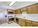Traditional kitchen design featuring wood cabinets and white counter tops at 3415 N 36Th St # 3, Phoenix, AZ 85018