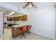 Eat-in kitchen with wood cabinets, breakfast bar, and tile flooring at 3415 N 36Th St # 3, Phoenix, AZ 85018