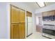 View of kitchen cabinets, fridge, stove, and microwave with neutral color scheme at 3415 N 36Th St # 3, Phoenix, AZ 85018