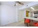 Kitchen with a breakfast bar with orange swivel chairs and wood cabinets at 3415 N 36Th St # 3, Phoenix, AZ 85018