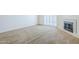 Bright and airy living area with fireplace and access to outdoor space at 3415 N 36Th St # 3, Phoenix, AZ 85018