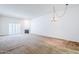 Spacious living room with fireplace, plantation shutters, and neutral carpet at 3415 N 36Th St # 3, Phoenix, AZ 85018