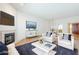 Bright living room with fireplace, modern furniture, and view to dining area at 3415 N 36Th St # 3, Phoenix, AZ 85018