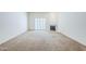 Spacious living room with large windows and a cozy fireplace at 3415 N 36Th St # 3, Phoenix, AZ 85018
