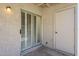 View of the outdoor patio with a storage closet and sliding glass doors with shutter blinds at 3415 N 36Th St # 3, Phoenix, AZ 85018