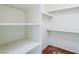 Spacious walk-in closet featuring white shelves, and neutral carpeting at 3415 N 36Th St # 3, Phoenix, AZ 85018