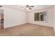 Spacious bedroom featuring neutral walls, plush carpet, and a ceiling fan for added comfort at 3507 W Oakland St, Chandler, AZ 85226