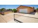 View of tan-colored single Gathering house, showing attached two-car garage and wide driveway at 3507 W Oakland St, Chandler, AZ 85226