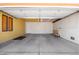 Spacious garage with concrete flooring, insulated garage door, and ample space for storage and parking at 3507 W Oakland St, Chandler, AZ 85226