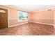 A vacant living room with tile floors, a large window, and neutral paint at 3507 W Oakland St, Chandler, AZ 85226