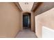 Covered entryway that leads to a dark front door at 37460 W Giallo Ln, Maricopa, AZ 85138