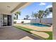 Backyard view with pool, trees, and stone deck at 389 W Fairway Pl, Chandler, AZ 85225