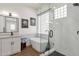 Modern bathroom with a soaking tub, glass-enclosed shower, and stylish fixtures at 389 W Fairway Pl, Chandler, AZ 85225