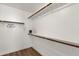 Walk-in closet with shelves and wood rod at 389 W Fairway Pl, Chandler, AZ 85225