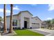 Beautiful single-story home with a well-maintained yard, prominent palm tree, and modern design elements at 389 W Fairway Pl, Chandler, AZ 85225