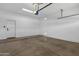 Spacious two car garage with concrete floor and automatic door at 389 W Fairway Pl, Chandler, AZ 85225