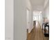 Inviting hallway featuring wood floors and stylish decor; natural light fills the space at 389 W Fairway Pl, Chandler, AZ 85225