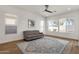 Bright living room with multiple windows, stylish rug, and a cozy sofa; perfect for relaxing at 389 W Fairway Pl, Chandler, AZ 85225