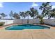 Outdoor pool, trees, and white brick fence at 389 W Fairway Pl, Chandler, AZ 85225