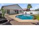 A private backyard pool with a well-kept gravel yard and a covered patio create an inviting outdoor space at 389 W Fairway Pl, Chandler, AZ 85225