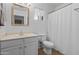 Bathroom with a vanity and white shower curtain at 43813 W Rio Lobo Dr, Maricopa, AZ 85138