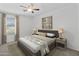 Staged bedroom showcases comfortable bedding and modern decor at 43813 W Rio Lobo Dr, Maricopa, AZ 85138