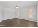 Bright bedroom with tile flooring, neutral paint, and two windows providing abundant natural light at 43813 W Rio Lobo Dr, Maricopa, AZ 85138