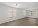 Spacious bedroom with neutral paint, and tile floors, offering a blank canvas for personalization at 43813 W Rio Lobo Dr, Maricopa, AZ 85138