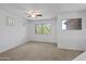 Bright bedroom with ceiling fan and two windows that bring in lots of light at 43813 W Rio Lobo Dr, Maricopa, AZ 85138