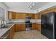 Well-lit kitchen features stainless steel appliances and lots of counter space at 43813 W Rio Lobo Dr, Maricopa, AZ 85138