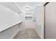 Spacious walk-in closet features custom shelving and ample storage at 43813 W Rio Lobo Dr, Maricopa, AZ 85138