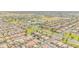 Panoramic aerial view of a Primary-planned community featuring landscaped streets, modern homes, and recreational facilities at 46068 W Guilder Ave, Maricopa, AZ 85139