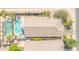 Stunning aerial view of a single Gathering home featuring a pool, spa, and outdoor seating area at 46068 W Guilder Ave, Maricopa, AZ 85139