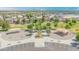 Neighborhood park featuring covered play areas, benches, and green spaces at 46068 W Guilder Ave, Maricopa, AZ 85139