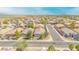 A neighborhood aerial shot of single-Gathering homes with tile roofs, desert landscaping, and clear blue skies at 46068 W Guilder Ave, Maricopa, AZ 85139