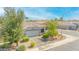 Aerial view of a single-story home with a neutral color palette, landscaped yard, and a two-car garage at 46068 W Guilder Ave, Maricopa, AZ 85139