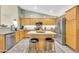 Modern kitchen featuring stainless steel appliances, granite countertops and center island at 46068 W Guilder Ave, Maricopa, AZ 85139