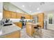 Bright kitchen featuring stainless steel appliances, center island, and ample storage at 46068 W Guilder Ave, Maricopa, AZ 85139
