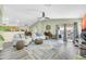 Open-concept living area with wood-style floors and access to the outdoor space at 46068 W Guilder Ave, Maricopa, AZ 85139