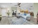 Inviting living room featuring stylish furniture, decor, and flooring at 46068 W Guilder Ave, Maricopa, AZ 85139