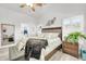 Spacious main bedroom with ample natural light, neutral walls and wood-style flooring at 46068 W Guilder Ave, Maricopa, AZ 85139