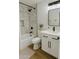 Modern bathroom with white vanity, sleek fixtures, and a stylish shower with marble-look tiling at 514 N 74Th St, Scottsdale, AZ 85257