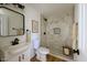 Modern bathroom with a stylish vanity, updated fixtures, and glass enclosed shower at 514 N 74Th St, Scottsdale, AZ 85257
