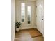 Bright entryway with wood flooring, decorative sidelight windows and a neutral color scheme at 514 N 74Th St, Scottsdale, AZ 85257