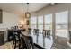 Bright dining room featuring a long wooden table, seating for six, and lots of natural light at 5735 E Mcdowell Rd # 108, Mesa, AZ 85215